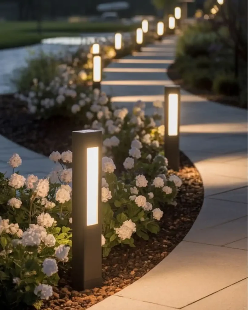 14. Modern Bollard Lights Bordering A Garden Path