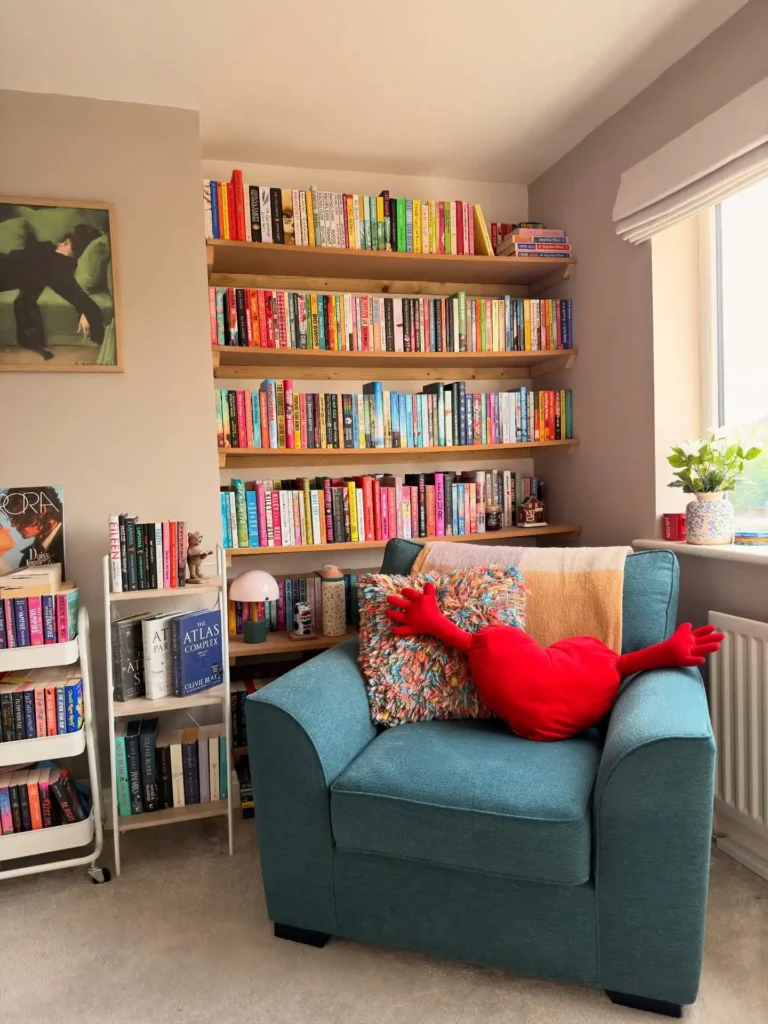 2. Sloped Ceiling Shelving with Armchair