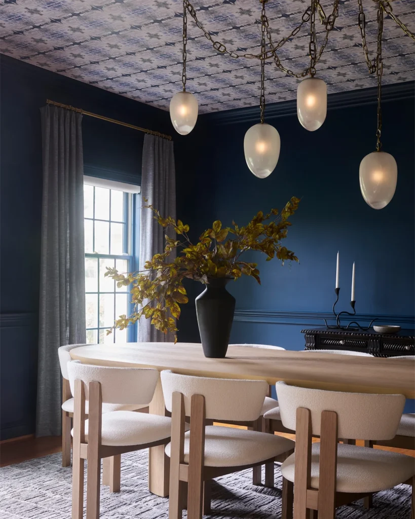 3. Deep Navy Walls with Cluster Pendant Lights