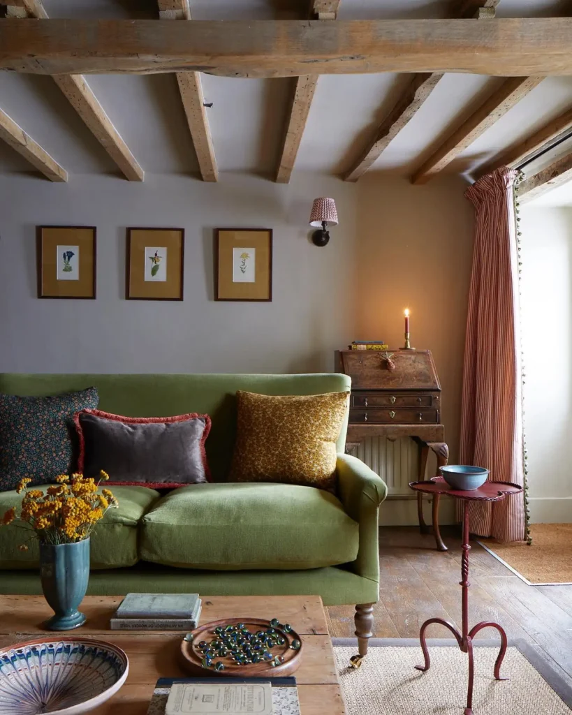 5. Beamed Ceiling Cottage Room with a Green Velvet Sofa