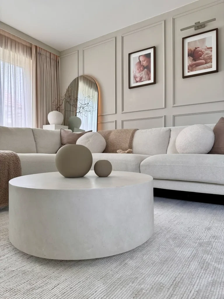 5. Beige Sectional Living Room with Round Concrete Table