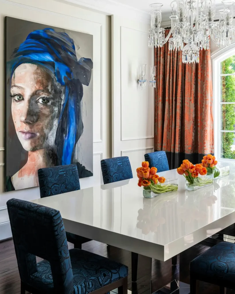 6. Navy Patterned Chairs Against a Bold Portrait