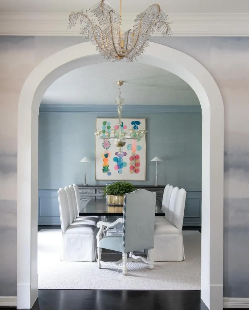 7. Arched Doorway Framing a Soft Blue Dining Room