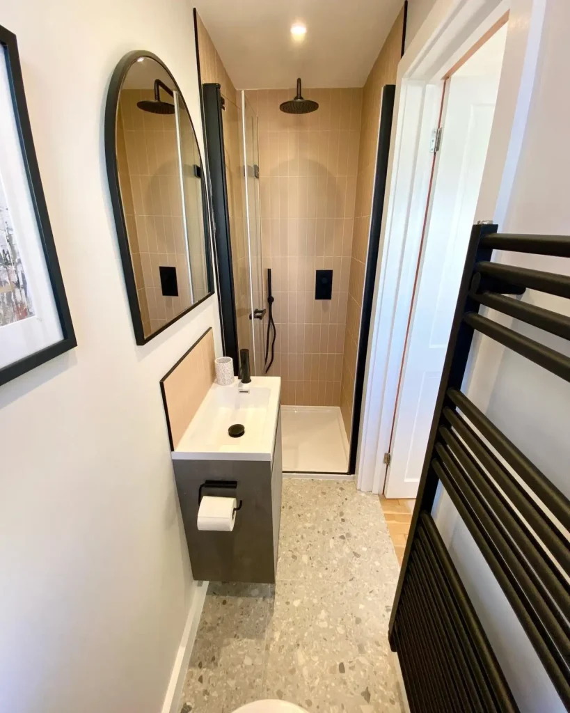 7. Black Ladder Towel Radiator in a Narrow Layout