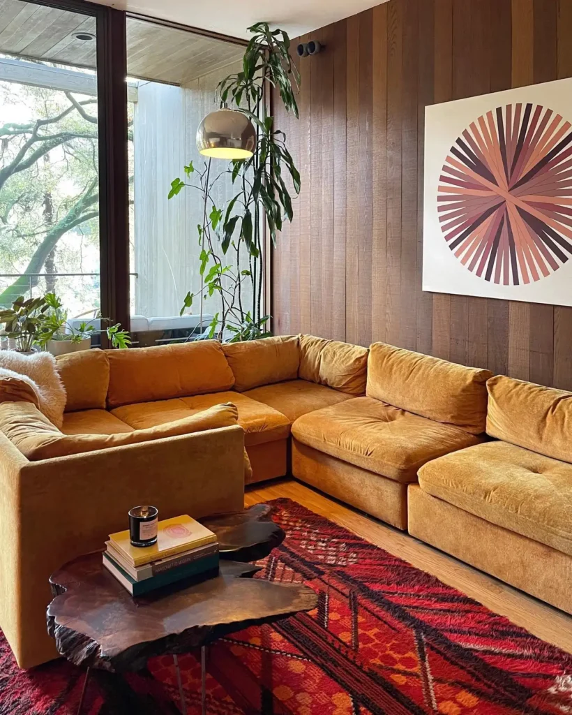 7. Mustard Sectional with a Sunburst Wall Art