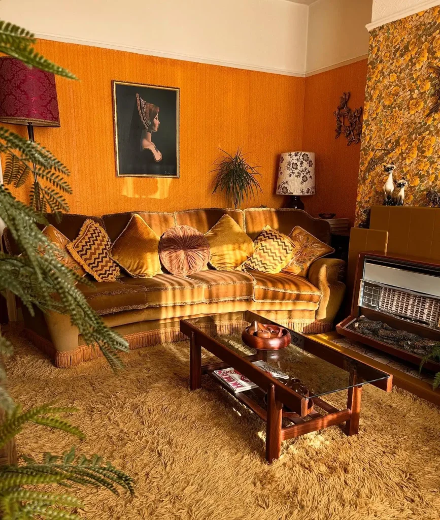 8. Fringed Velvet Sofa with a Vintage Portrait