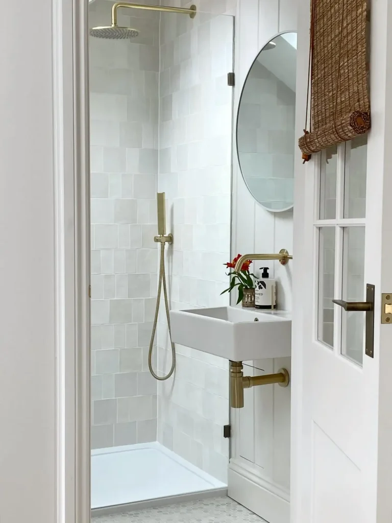 8. Wall Hung Sink with Exposed Brass Plumbing