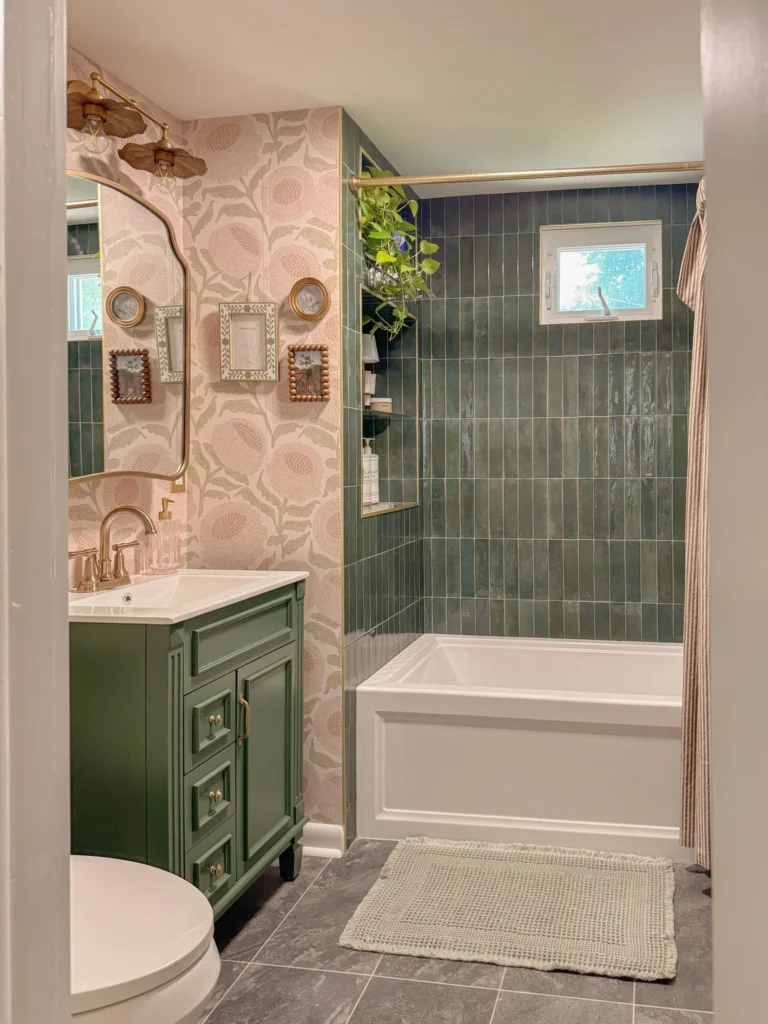 9. Bold Floral Wallpaper Paired with Green Vanity