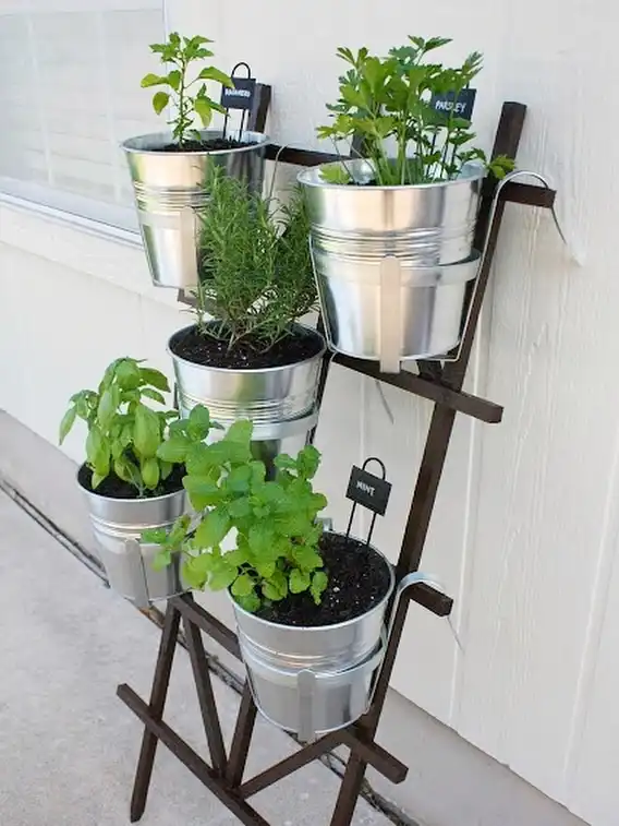 9. Galvanized Bucket Ladder Stand
