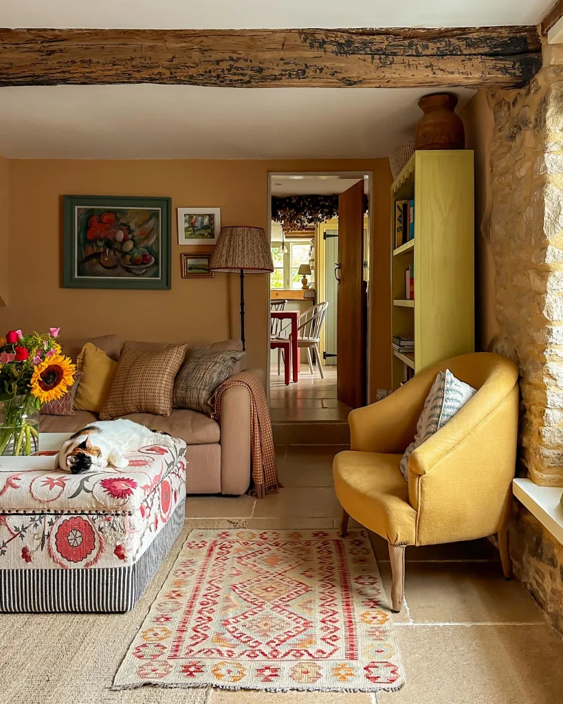 10. Exposed Stone Wall With Mustard Armchair