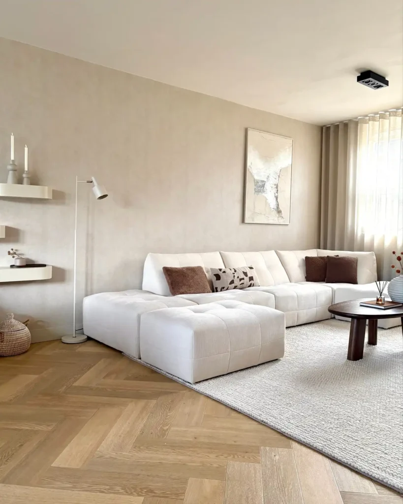 12. Modern White Sectional On Herringbone Wood Floor