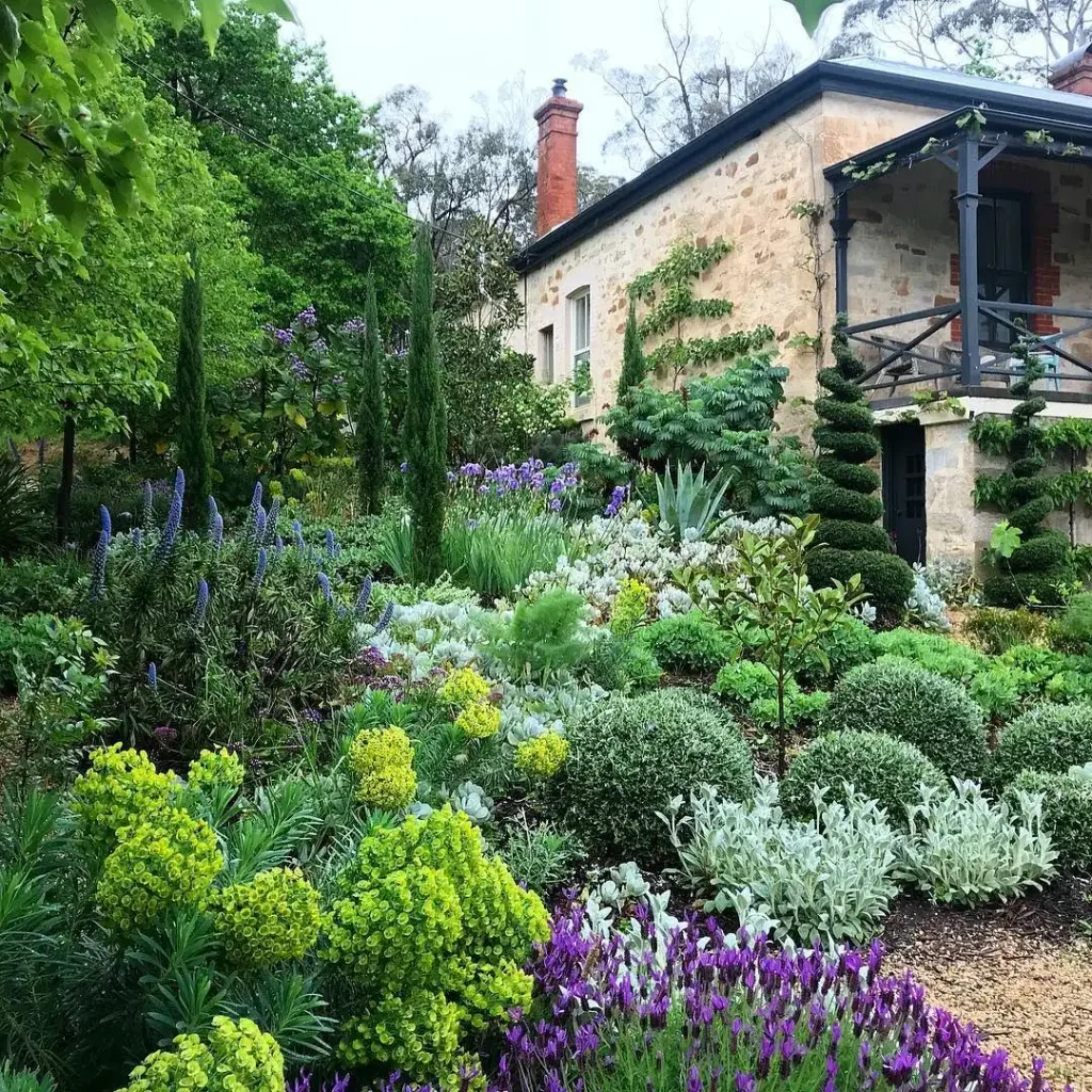 6. Cottage Style Garden with Spiral Topiary