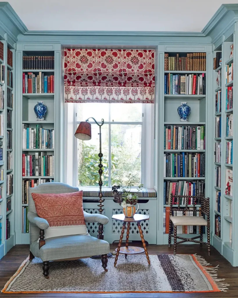 14 Cozy Living Room Reading Corners Built Around One Armchair 8 7. Grey Chair Framed by Powder Blue Bookcases