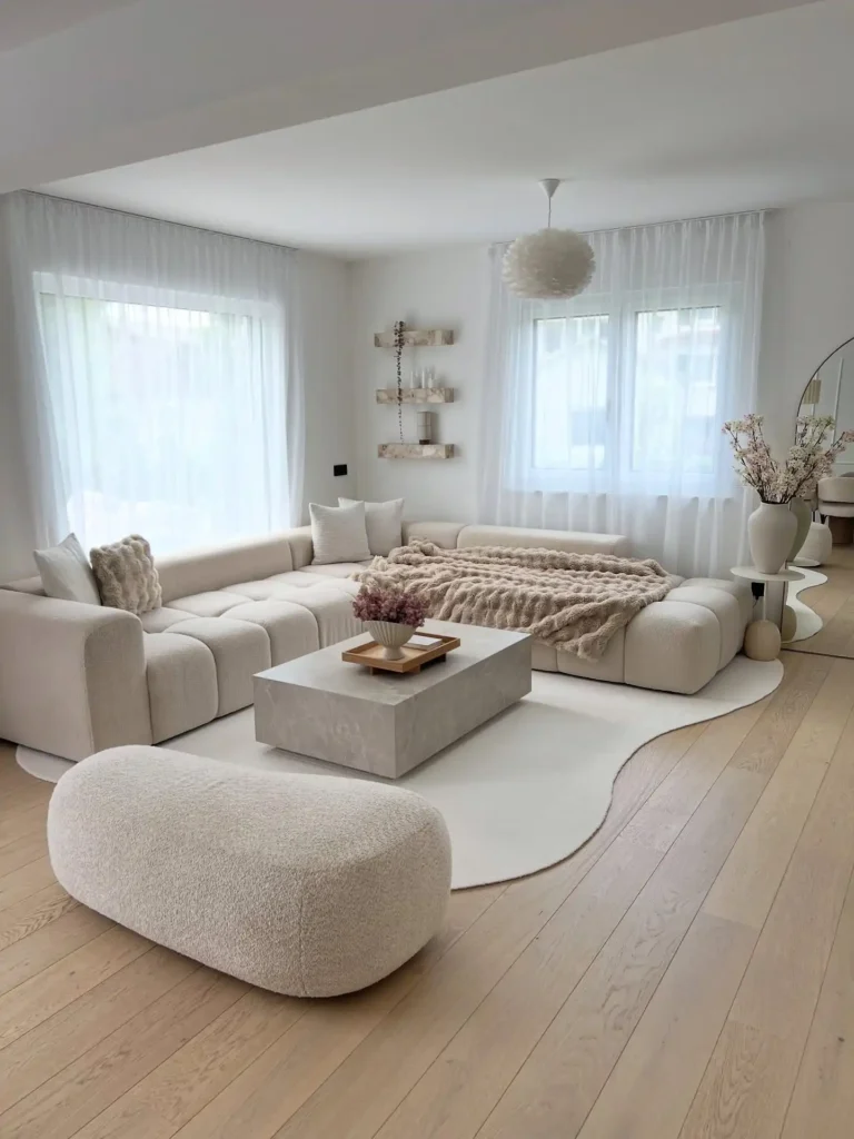 8. Boucle Beige Living Room With Tufted Sectional And Curved Rug