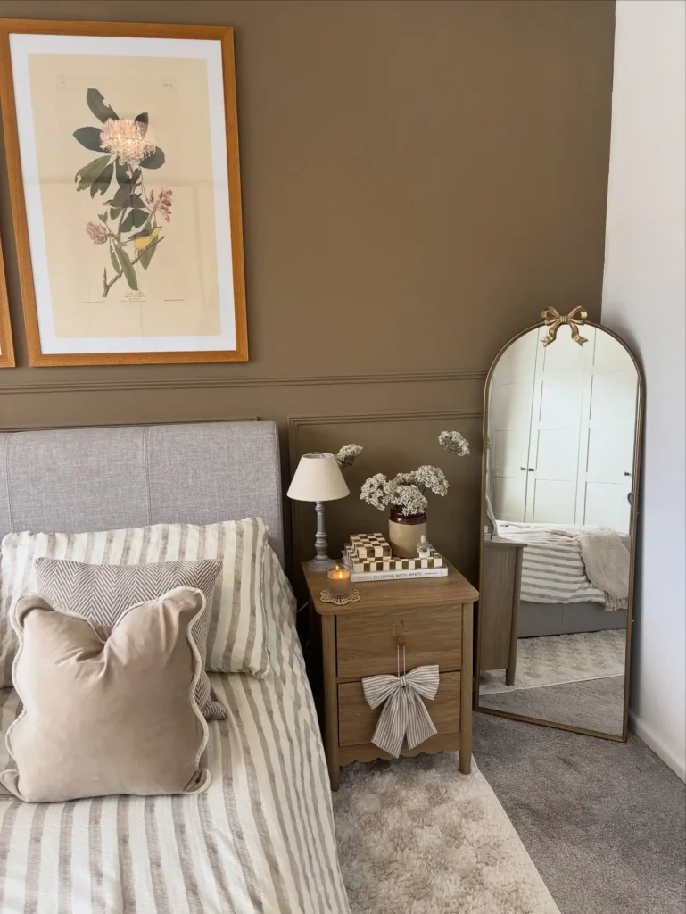 8. Wooden Nightstand with Bow Topped Arch Mirror