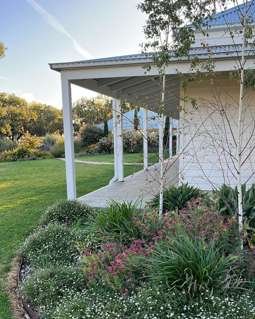 9. Farmhouse Verandah Garden with Flowering Groundcover