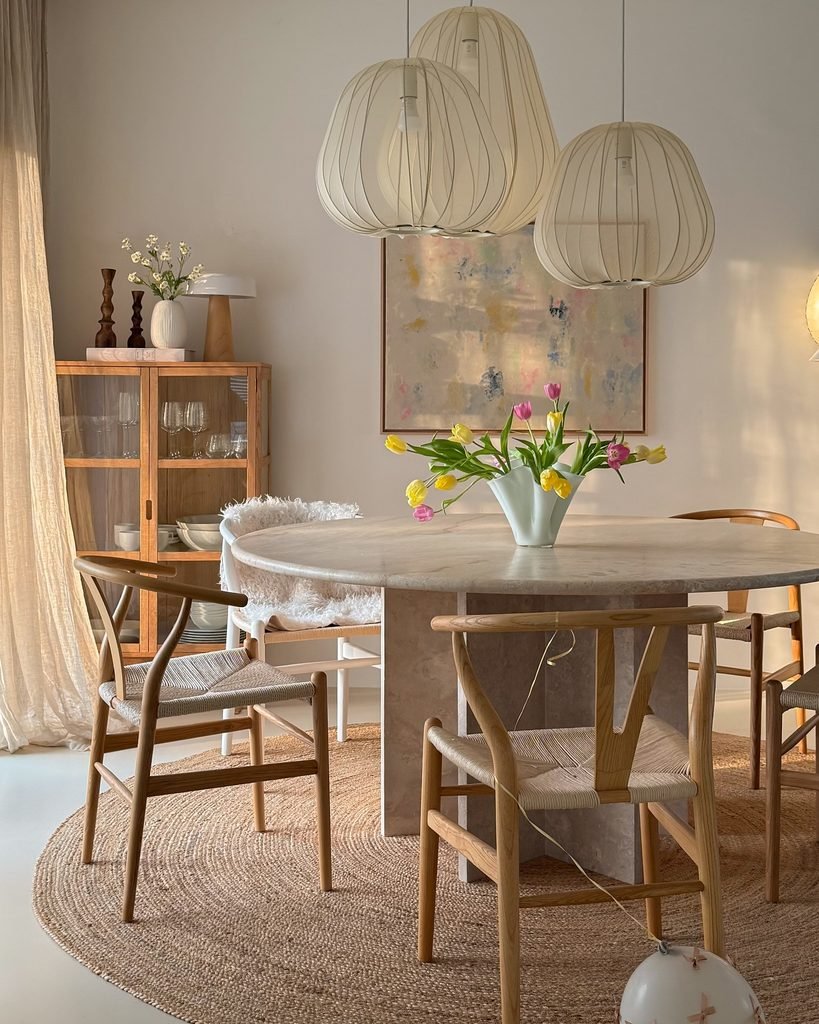 2. Woven Pendant Lights Over a Stone Table