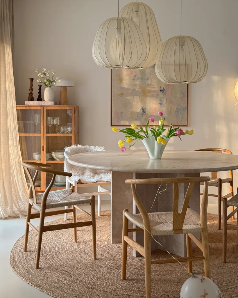 2. Woven Pendant Lights Over a Stone Table