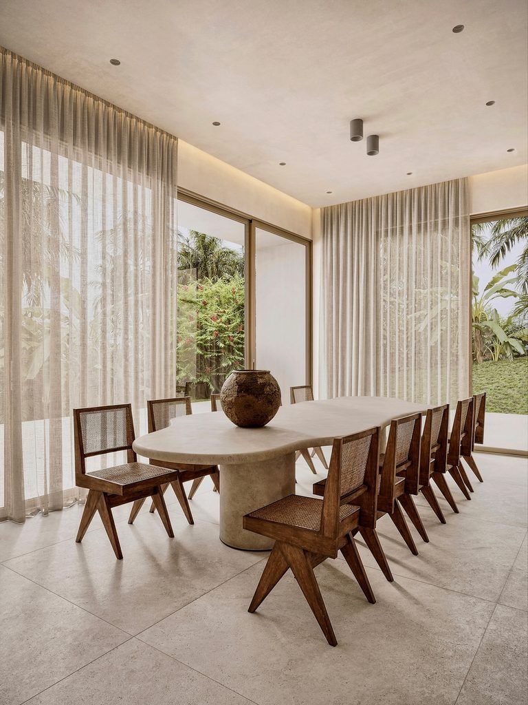8. Sculptural Plaster Table With Cane Chairs 768x1024 1
